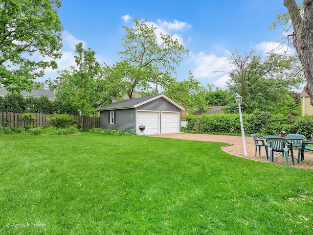 671 Euclid Ave, Glen Ellyn, IL 60137 - view of yard featuring a garage and an outbuilding