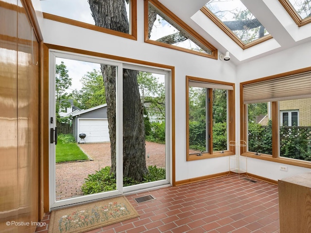 671 Euclid Ave, Glen Ellyn, IL 60137 - unfurnished sunroom featuring healthy amount of natural light, baseboards, a skylight, and high vaulted ceiling