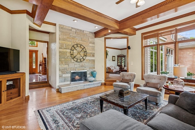 3 Shoreside Dr, South Barrington, IL 60010 - living area with beam ceiling, a ceiling fan, wood finished floors, a fireplace, and ornamental molding