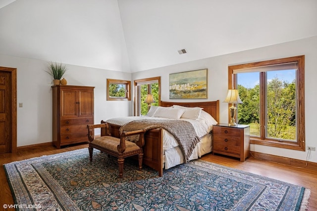 3 Shoreside Dr, South Barrington, IL 60010 - bedroom with light wood-style flooring, multiple windows, and high vaulted ceiling