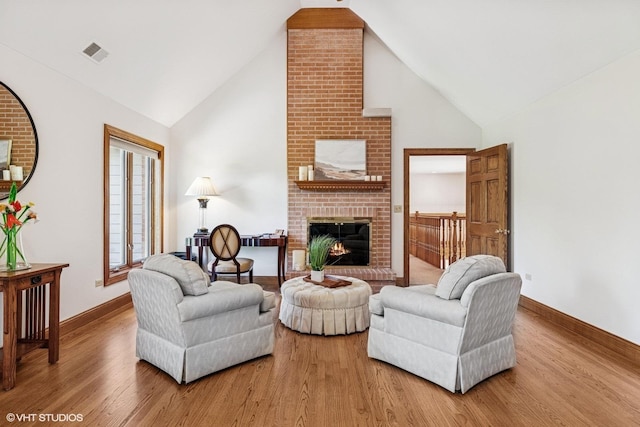 3 Shoreside Dr, South Barrington, IL 60010 - living room with wood finished floors, high vaulted ceiling, and a brick fireplace
