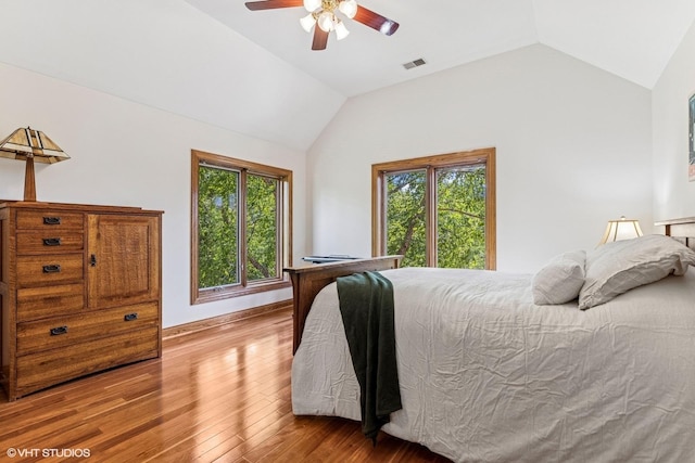 3 Shoreside Dr, South Barrington, IL 60010 - bedroom with wood-type flooring, vaulted ceiling, multiple windows, and a ceiling fan