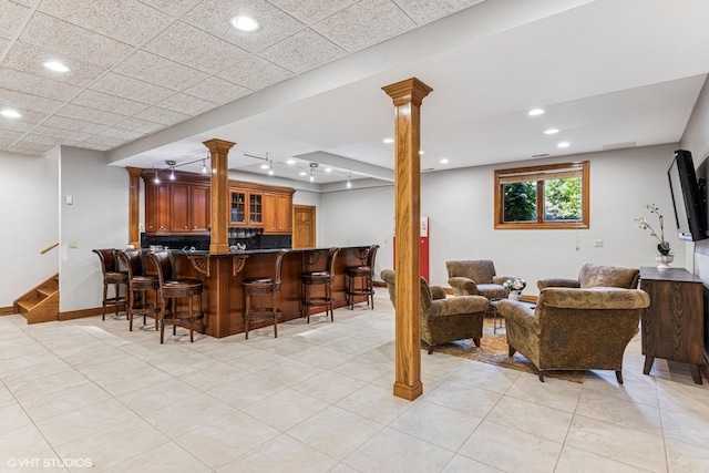 3 Shoreside Dr, South Barrington, IL 60010 - living room with decorative columns, bar area, stairway, recessed lighting, and light tile patterned floors