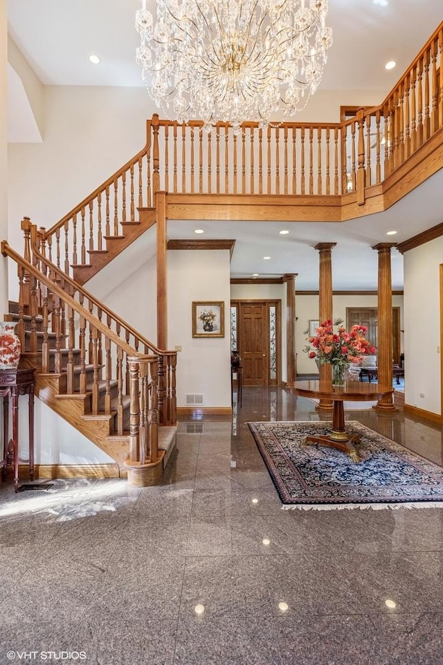 3 Shoreside Dr, South Barrington, IL 60010 - entrance foyer featuring granite floors, a high ceiling, a chandelier, decorative columns, and stairway