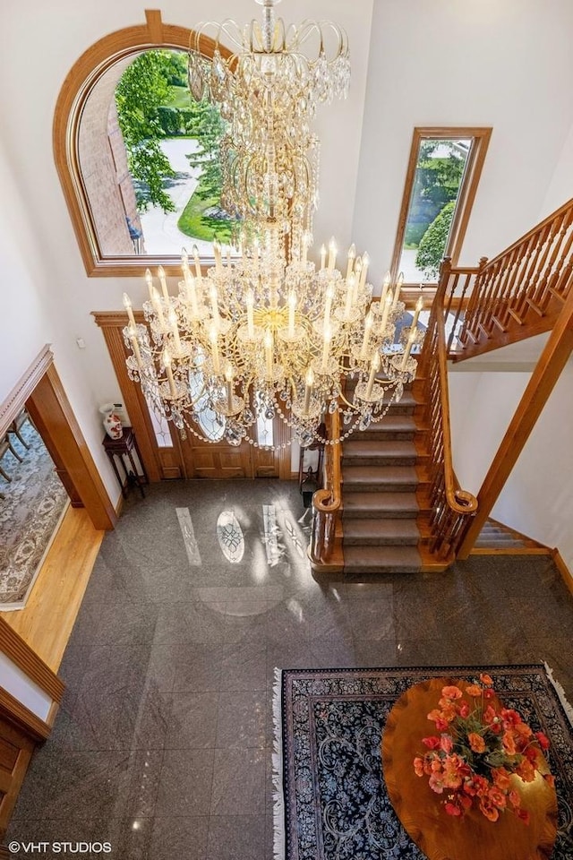 3 Shoreside Dr, South Barrington, IL 60010 - entrance foyer with a chandelier, a high ceiling, granite floors, and stairs