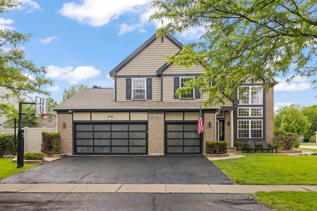 1462 Haversham Dr, Aurora, IL 60502 - view of front of property featuring asphalt driveway, brick siding, an attached garage, and roof with shingles