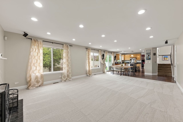 1462 Haversham Dr, Aurora, IL 60502 - carpeted living area featuring recessed lighting, baseboards, and stairs