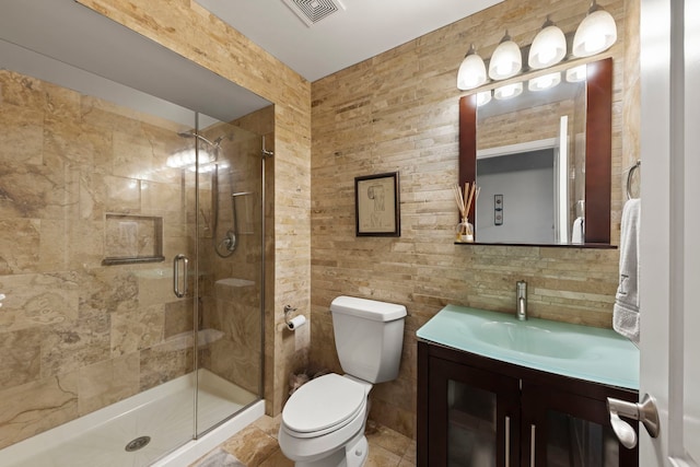 1462 Haversham Dr, Aurora, IL 60502 - bathroom with toilet, a shower stall, vanity, and tile walls