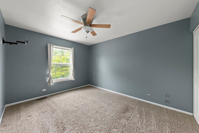 1462 Haversham Dr, Aurora, IL 60502 - carpeted empty room with ceiling fan and baseboards