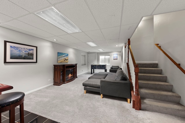 1462 Haversham Dr, Aurora, IL 60502 - carpeted living room featuring a paneled ceiling, a lit fireplace, stairway, and baseboards