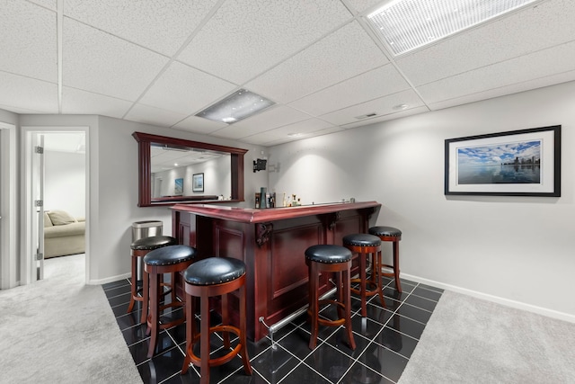 1462 Haversham Dr, Aurora, IL 60502 - indoor dry bar with baseboards, a drop ceiling, and dark carpet