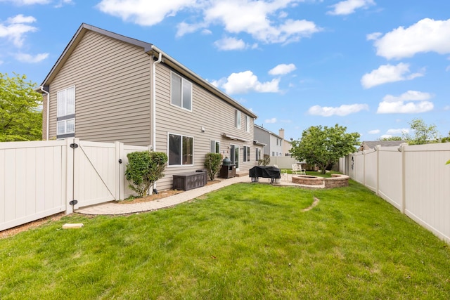 1462 Haversham Dr, Aurora, IL 60502 - rear view of house with a gate, a fire pit, and a patio