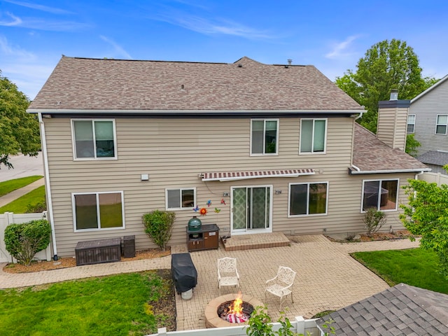1462 Haversham Dr, Aurora, IL 60502 - back of property with a patio area, a fire pit, and a shingled roof