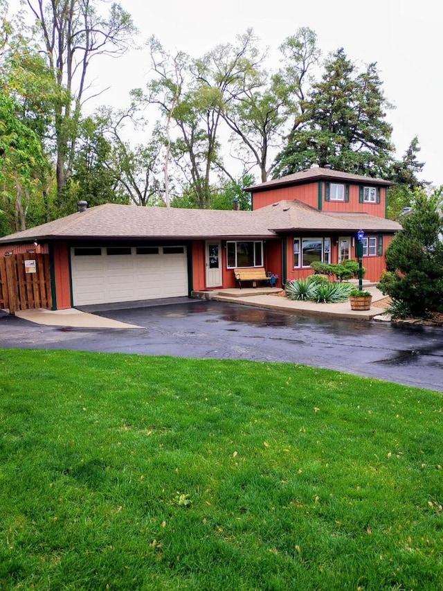 5116 154th St, Oak Forest, IL 60452 - view of front of property with a front yard, asphalt driveway, and a garage