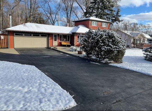 5116 154th St, Oak Forest, IL 60452 - tri-level home with a garage, driveway, and a chimney