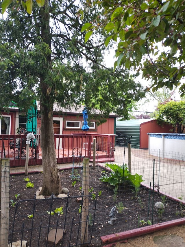 5116 154th St, Oak Forest, IL 60452 - view of yard with a deck and a vegetable garden