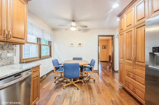 5639 W Montrose Ave, Chicago, IL 60634 - dining space featuring ceiling fan, wood finished floors, and baseboards