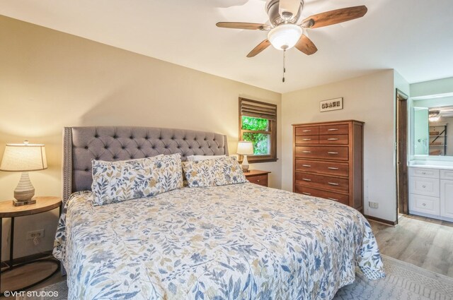 5639 W Montrose Ave, Chicago, IL 60634 - bedroom featuring wood finished floors, ensuite bath, ceiling fan, and baseboards