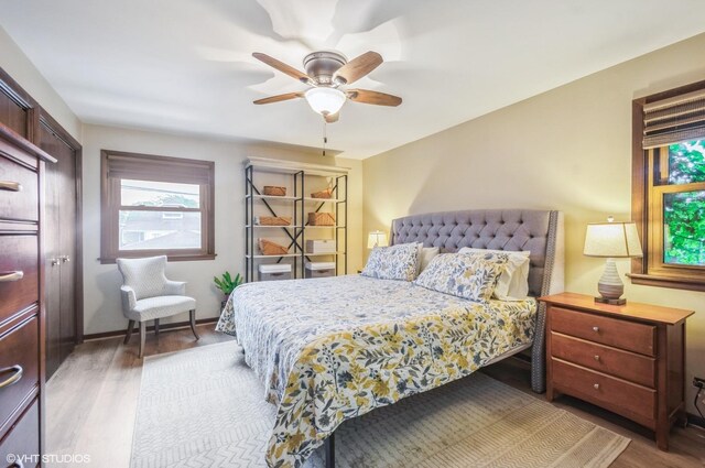 5639 W Montrose Ave, Chicago, IL 60634 - bedroom with wood finished floors, a ceiling fan, and baseboards