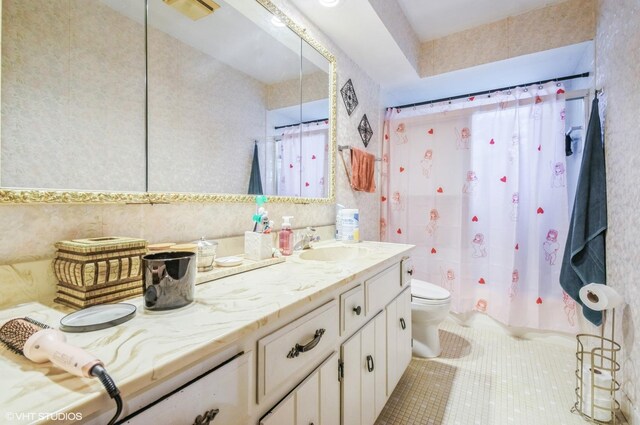 5639 W Montrose Ave, Chicago, IL 60634 - bathroom featuring vanity, toilet, tile patterned floors, and wallpapered walls