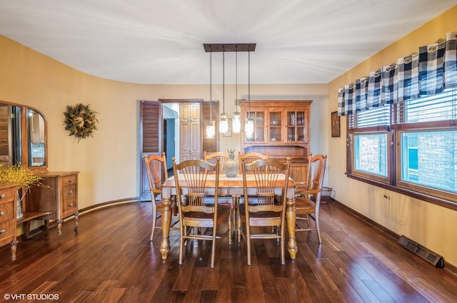 5639 W Montrose Ave, Chicago, IL 60634 - dining room with dark wood-style flooring and baseboards