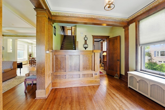 706 Franklin Ave, River Forest, IL 60305 - foyer featuring radiator heating unit, wood finished floors, decorative columns, and ornamental molding