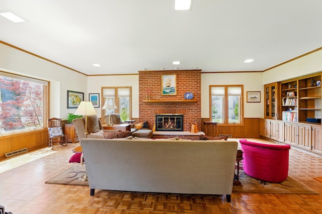 706 Franklin Ave, River Forest, IL 60305 - living area featuring crown molding, a wainscoted wall, healthy amount of natural light, a brick fireplace, and wood walls