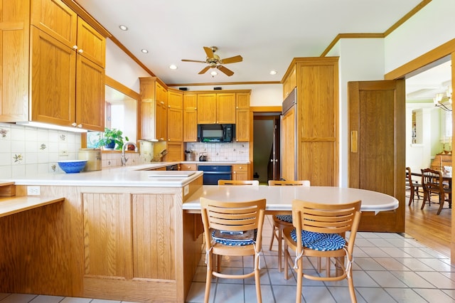 706 Franklin Ave, River Forest, IL 60305 - kitchen with black microwave, crown molding, a ceiling fan, a peninsula, and decorative backsplash