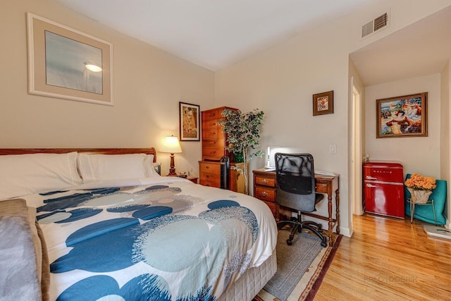 5942 S King Dr Unit 2N, Chicago, IL 60637 - bedroom with wood finished floors, an office area, and baseboards