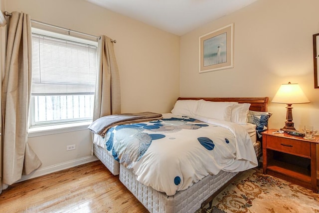 5942 S King Dr Unit 2N, Chicago, IL 60637 - bedroom with light wood finished floors and baseboards