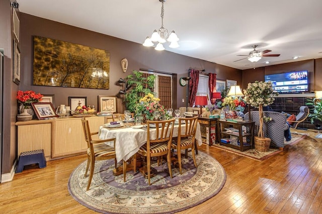 5942 S King Dr Unit 2N, Chicago, IL 60637 - dining room with light wood finished floors, a chandelier, and a ceiling fan