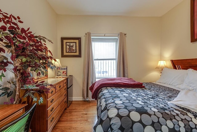 5942 S King Dr Unit 2N, Chicago, IL 60637 - bedroom with light wood-type flooring and baseboards