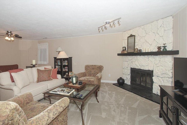 196 Shoreline Rd, Lake Barrington, IL 60010 - living room with ceiling fan, carpet floors, a stone fireplace, and baseboards