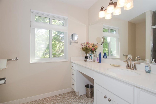 196 Shoreline Rd, Lake Barrington, IL 60010 - bathroom with healthy amount of natural light, vanity, baseboards, and a chandelier