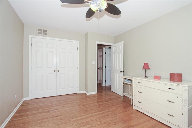 196 Shoreline Rd, Lake Barrington, IL 60010 - bedroom with light wood-style floors, baseboards, a closet, and a ceiling fan