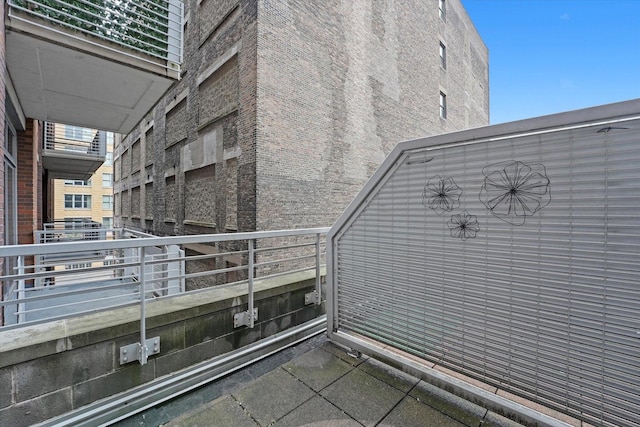 933 W Van Buren St Unit 320, Chicago, IL 60607 - view of side of home with brick siding and a balcony