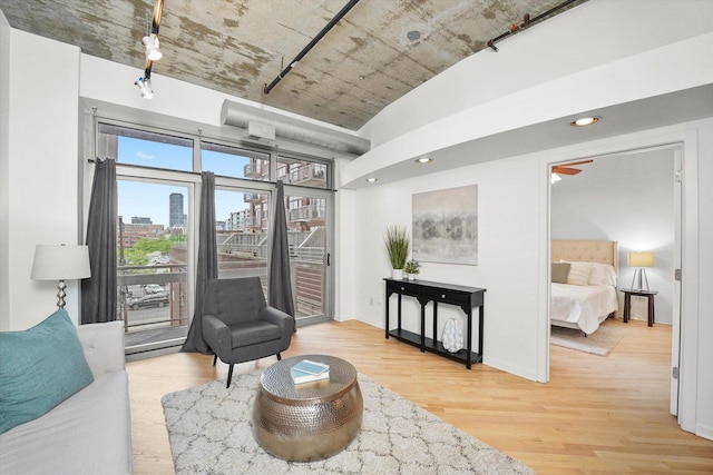 933 W Van Buren St Unit 320, Chicago, IL 60607 - living room with wood finished floors, a city view, baseboards, and recessed lighting