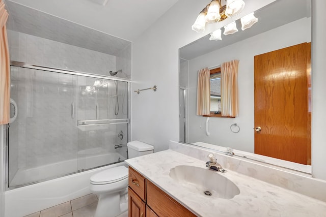 1212 Ashford Ln, Joliet, IL 60431 - bathroom featuring vanity, combined bath / shower with glass door, tile patterned floors, toilet, and a chandelier