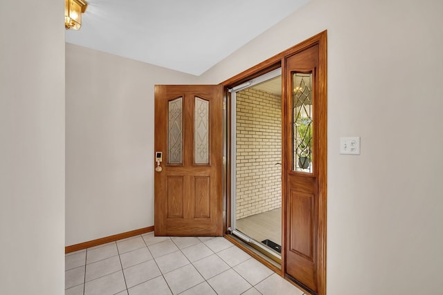 1212 Ashford Ln, Joliet, IL 60431 - foyer featuring light tile patterned floors and baseboards