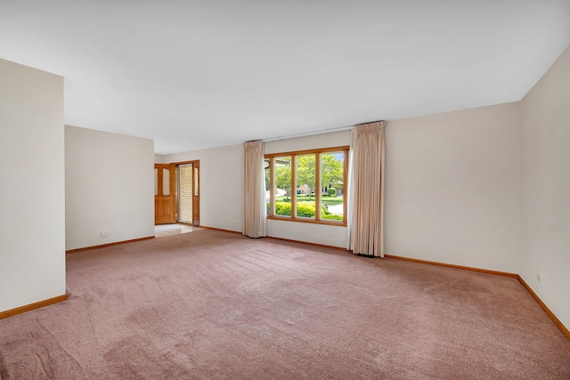 1212 Ashford Ln, Joliet, IL 60431 - empty room featuring light carpet and baseboards