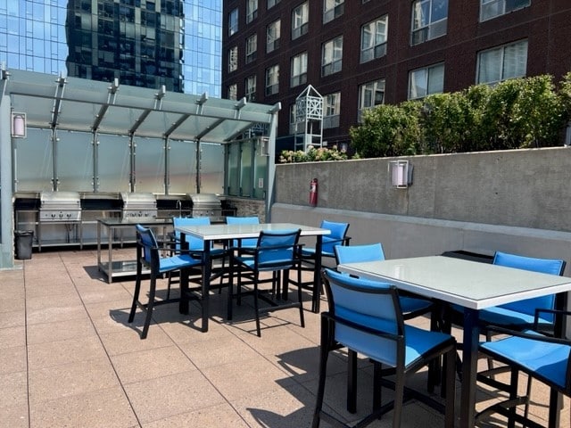 474 N Lake Shore Dr Unit 5306, Chicago, IL 60611 - view of patio featuring outdoor dining area and an outdoor kitchen