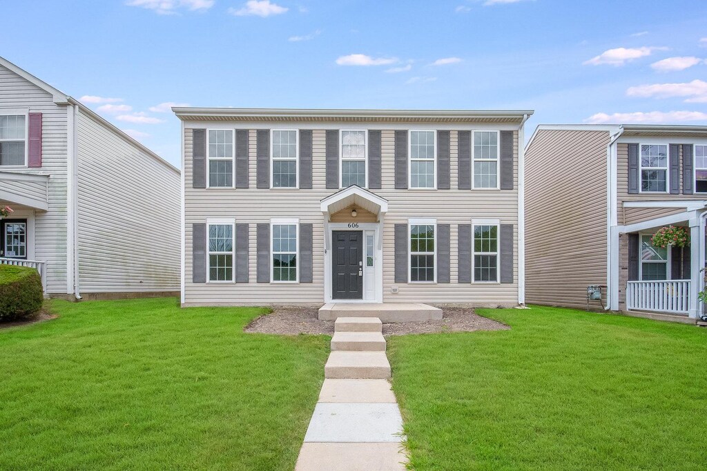 606 Four Seasons Blvd, Aurora, IL 60504 - view of front facade featuring a front yard
