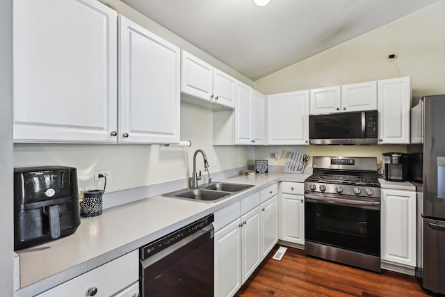 415 Hidden Creek Ln Unit 415, North Aurora, IL 60542 - kitchen with stainless steel appliances, a sink, lofted ceiling, white cabinetry, and light countertops