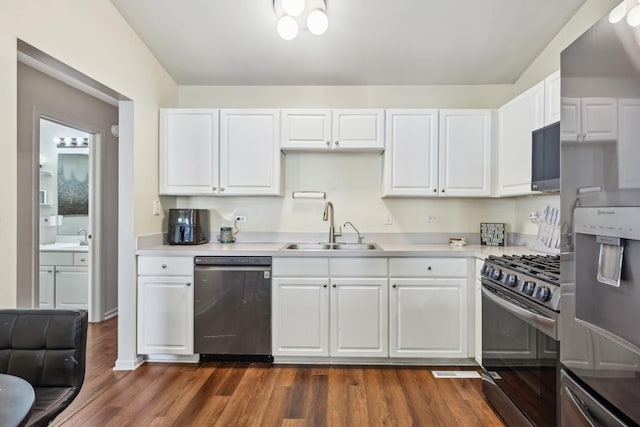 415 Hidden Creek Ln Unit 415, North Aurora, IL 60542 - kitchen featuring appliances with stainless steel finishes, a sink, light countertops, and white cabinets