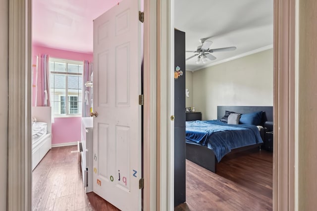 415 Hidden Creek Ln Unit 415, North Aurora, IL 60542 - bedroom with crown molding, wood finished floors, and ceiling fan
