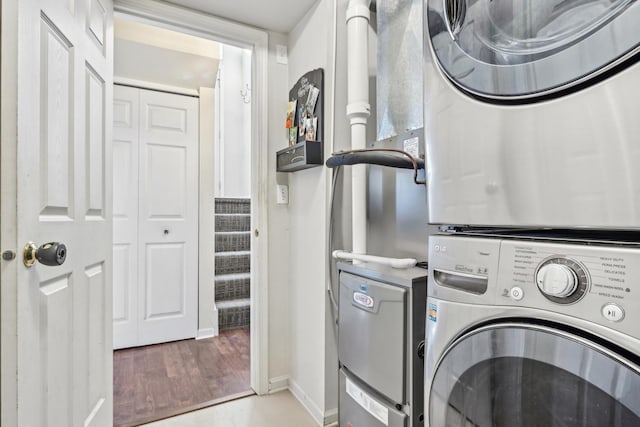 415 Hidden Creek Ln Unit 415, North Aurora, IL 60542 - washroom with stacked washer and clothes dryer, baseboards, and wood finished floors