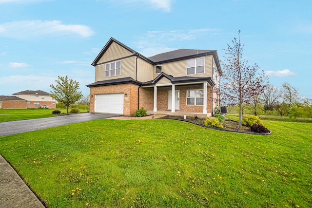 22334 Ojai Dr, Richton Park, IL 60471 - traditional-style house featuring an attached garage, asphalt driveway, brick siding, and a front lawn