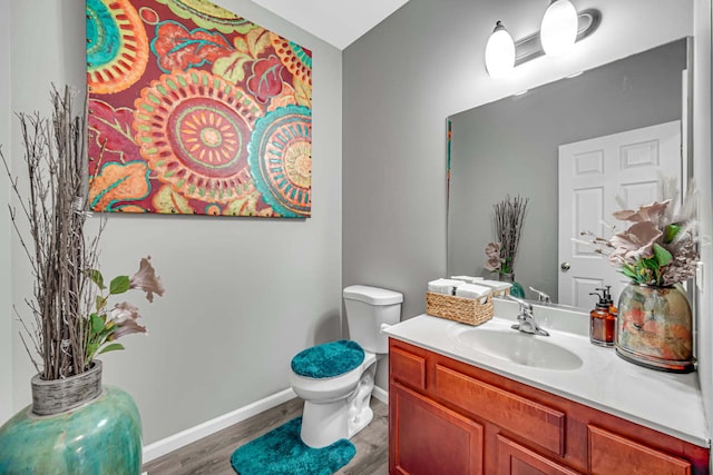 22334 Ojai Dr, Richton Park, IL 60471 - bathroom featuring wood finished floors, toilet, baseboards, and vanity