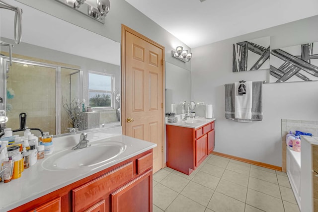 22334 Ojai Dr, Richton Park, IL 60471 - bathroom featuring two vanities, a garden tub, tile patterned flooring, a stall shower, and baseboards