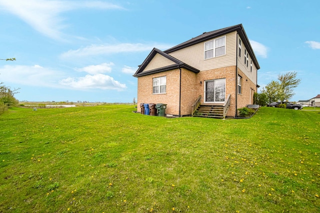 22334 Ojai Dr, Richton Park, IL 60471 - rear view of house featuring a lawn